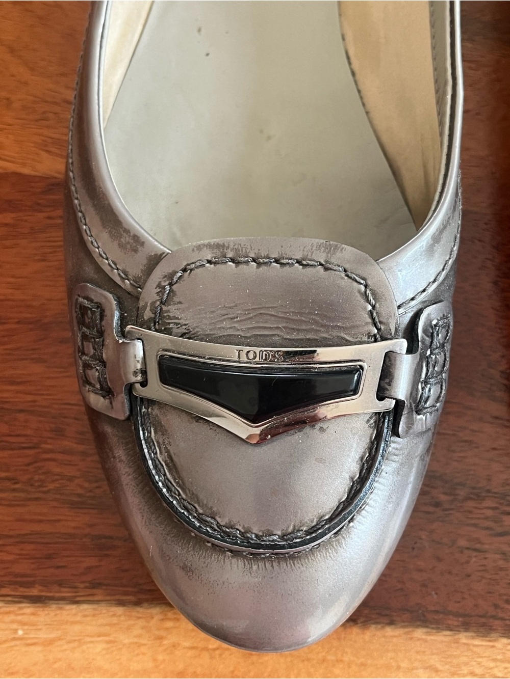Tod's Metallic Silver Leather Loafer with Black Enamel Trim